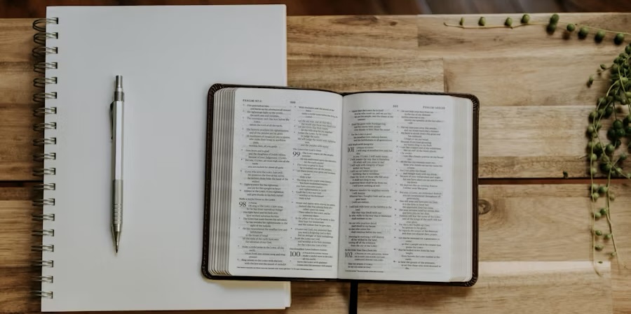 a Bible, notebook, and pen